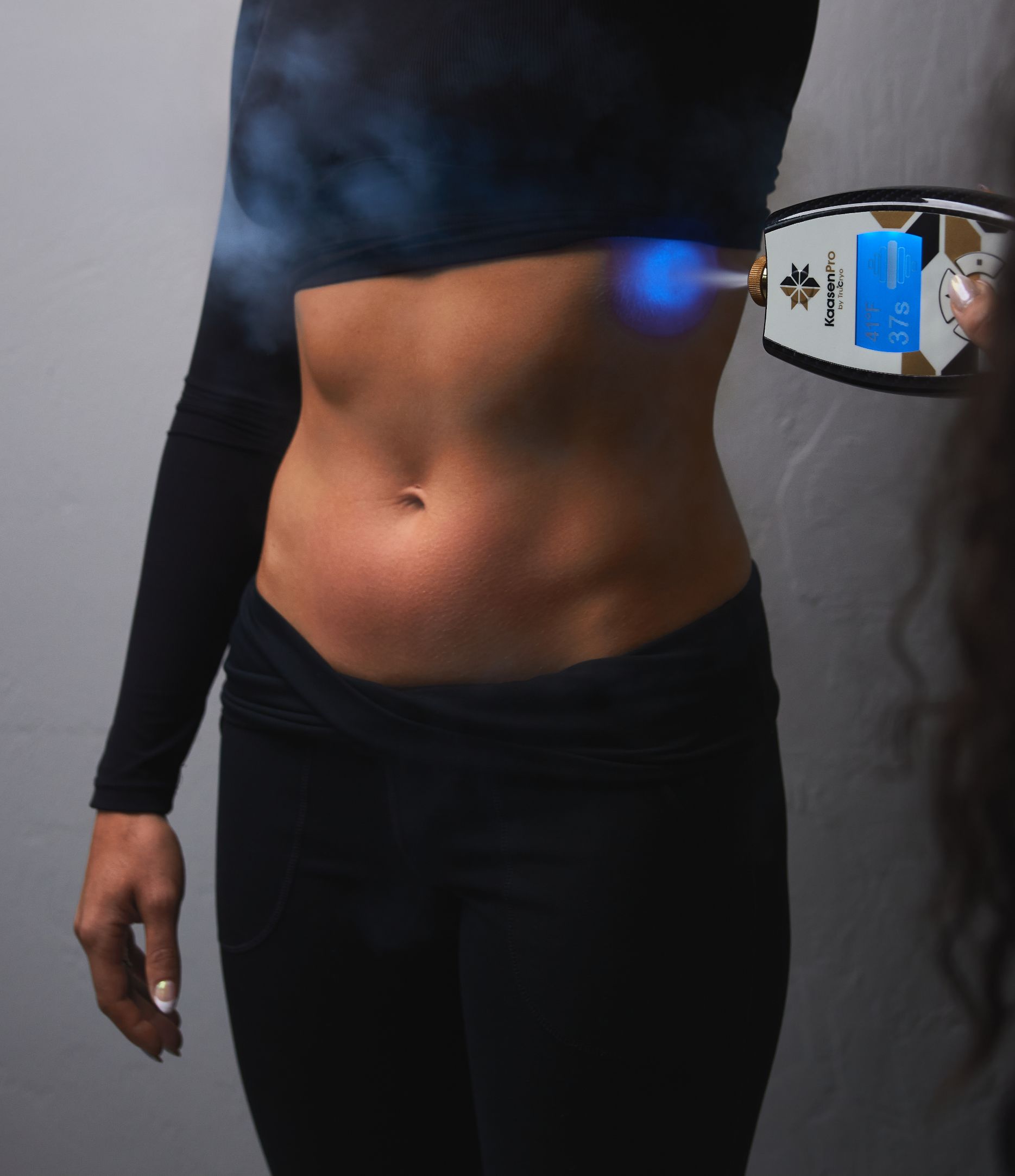 A woman receiving cryo slimming treatment on her stomach